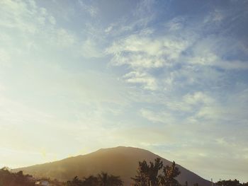 Scenic view of silhouette mountains against sky at sunset