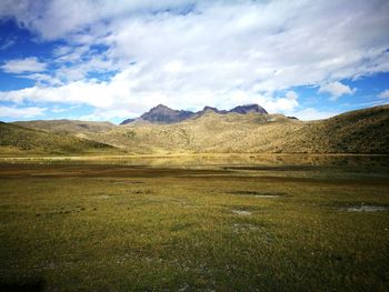 View of landscape against cloudy sky