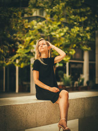 Young woman sitting outdoors