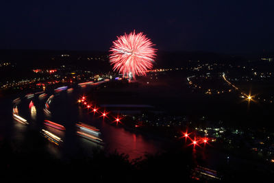 Firework display in city at night