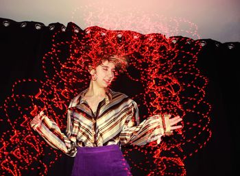 Digital composite image of woman with red light