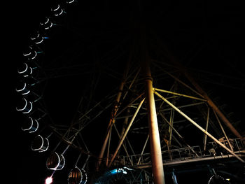 Low angle view of illuminated building against sky