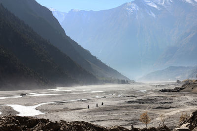 Panoramic view of snowcapped mountains against sky