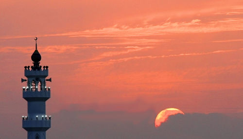 View of communications tower at sunset