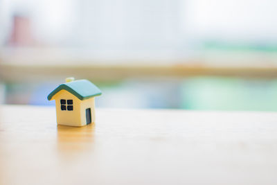 Close-up of model home on table