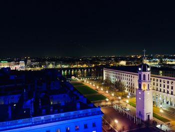 High angle view of illuminated buildings in city at night