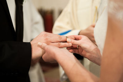 Midsection of people on the wall