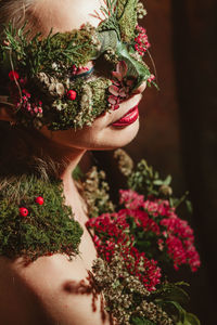 Close-up of woman with plants