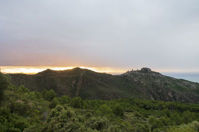 Scenic view of mountains against sky during sunset