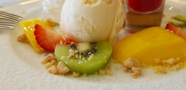 Close-up of fruits in plate on table