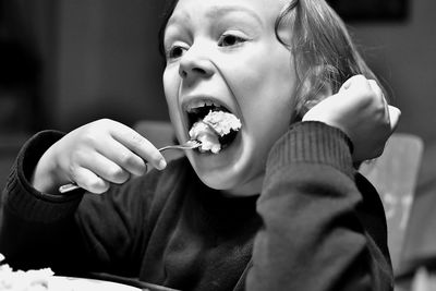 Close-up of boy eating food