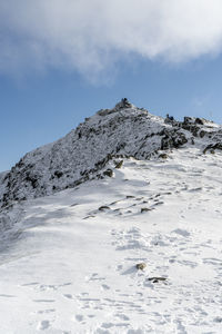 Scenic view of snowcapped mountain against sky