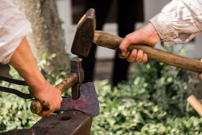 Close-up of man working on cutting board