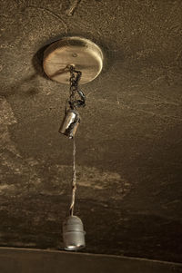 High angle view of electric lamp hanging on wall at home