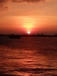 Scenic view of sea against romantic sky at sunset