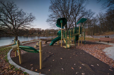 Empty park against sky during winter