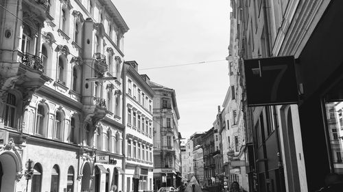 Low angle view of buildings in city against sky