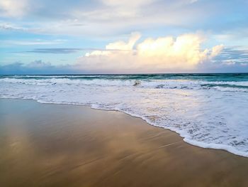 Scenic view of beach against sky during sunset