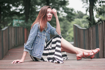 Young woman sitting outdoors