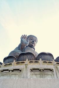 Low angle view of statue against sky