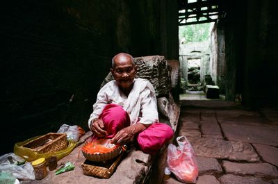 Portrait of man sitting outdoors