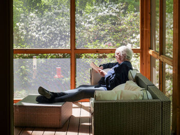 Man sitting on chair at home