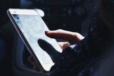 Close-up of woman using mobile phone