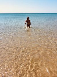 Full length of man on beach against sky