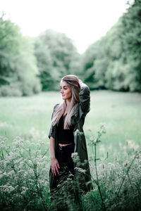 Young woman standing on field