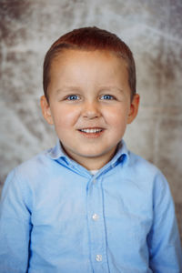 Portrait of cute boy standing outdoors