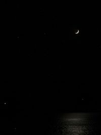 Scenic view of sea against sky at night