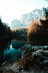 Scenic view of lake against sky during winter