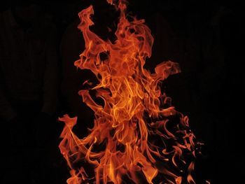 Close-up of bonfire against black background