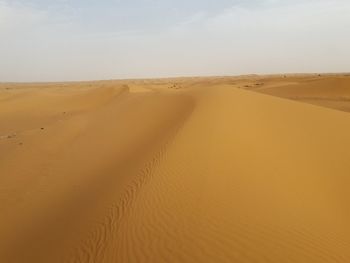 Scenic view of desert against sky