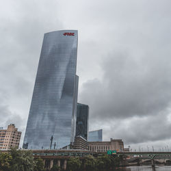 Low angle view of modern buildings against sky in city