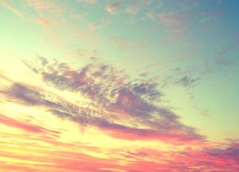 Low angle view of cloudy sky at sunset