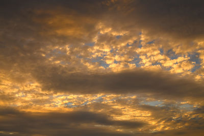 Low angle view of dramatic sky during sunset