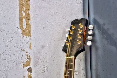 Close-up of guitar on wall