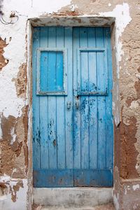 Blue closed door of old building