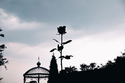 Low angle view of silhouette street light against sky