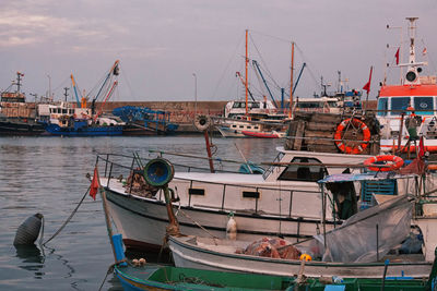 Boats moored at harbor