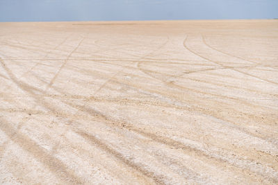 High angle view of tire tracks on land