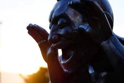 Low angle view of statue against sky