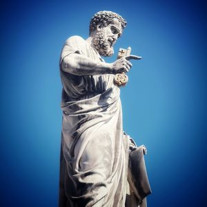 Low angle view of statue against clear blue sky