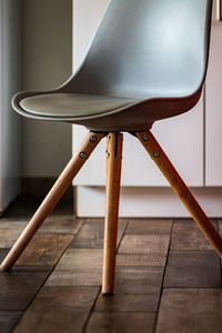 Close-up of chair on hardwood floor