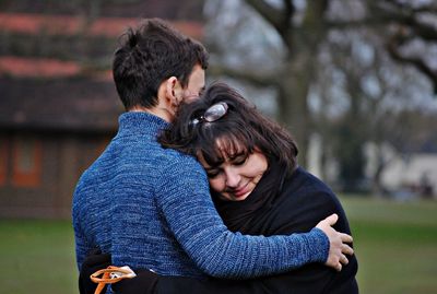 Young couple kissing outdoors