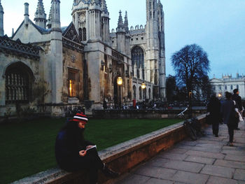 People in front of historic building