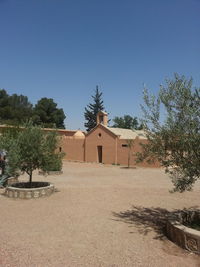 House against clear blue sky