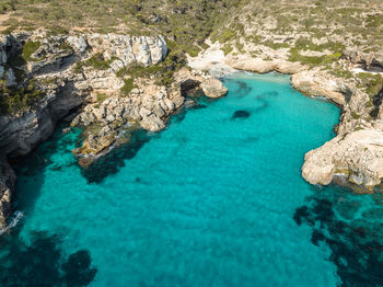 Aerial view of beautiful beach bay cala marmols, mallorca, spain