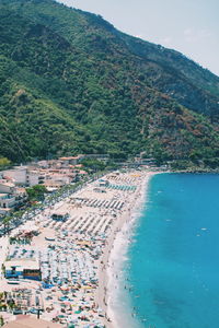 High angle view of townscape by sea